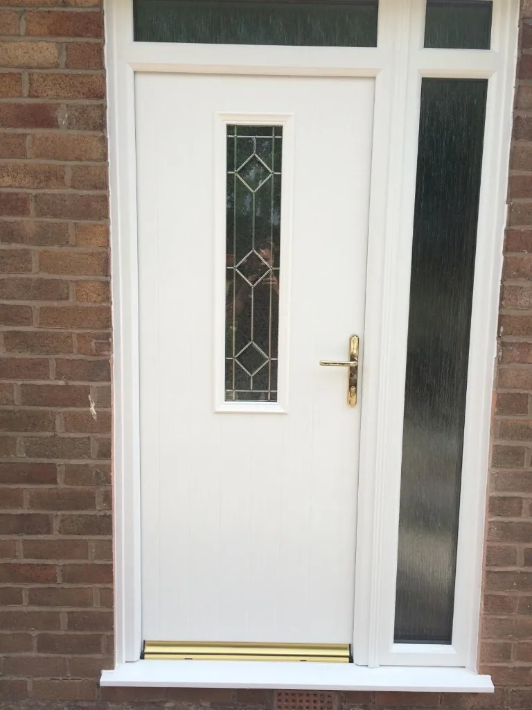 White composite front door with decorative glazing and side panel