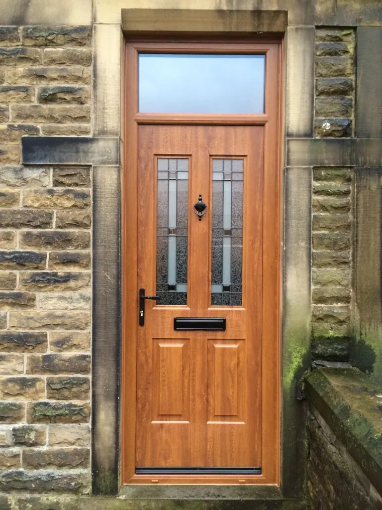 Golden oak composite front door with top light