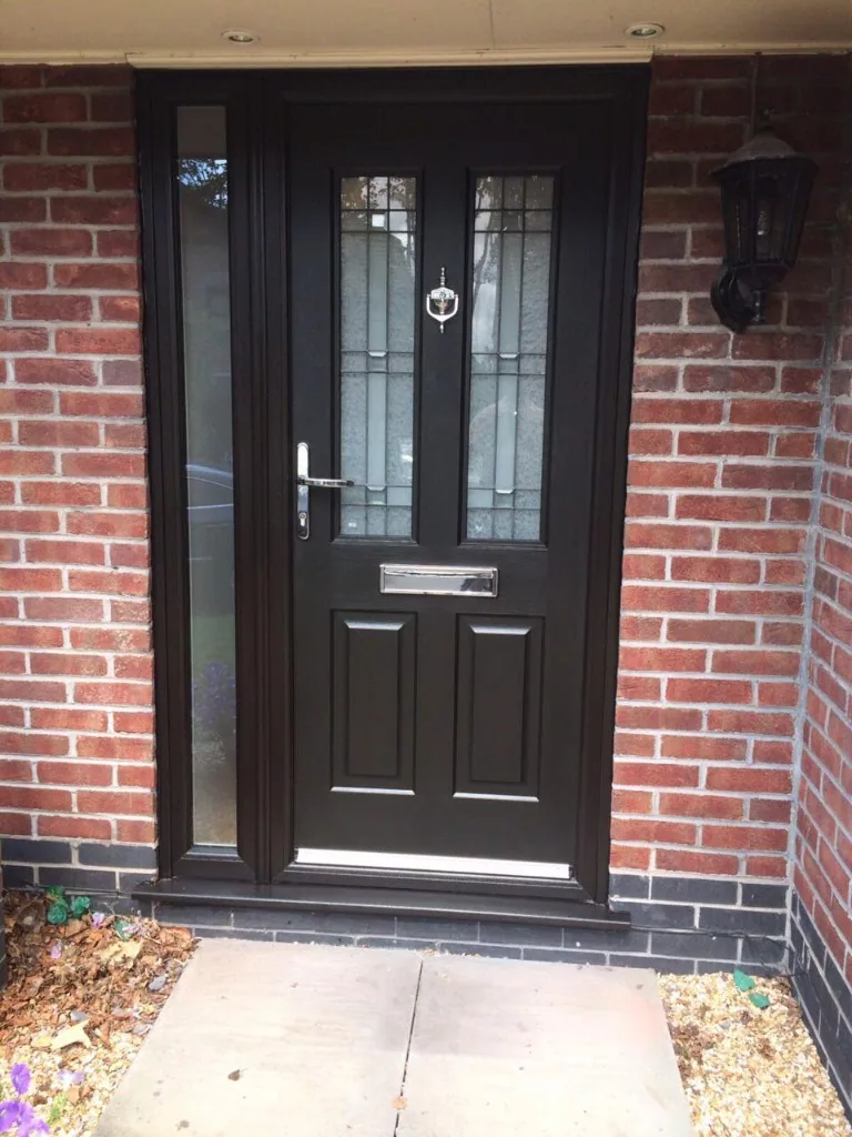 Black composite front door with side panel