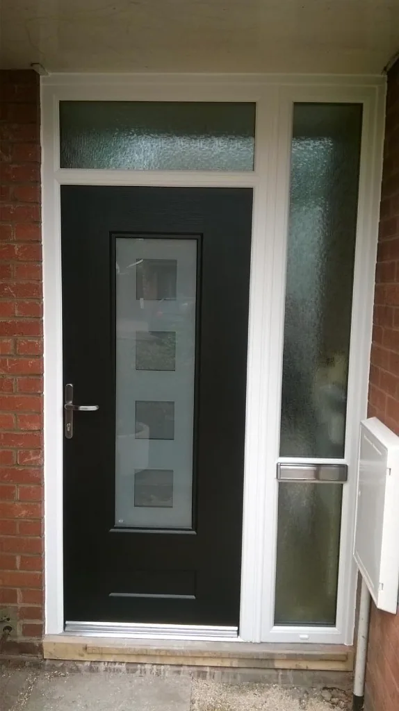 Black composite front door with frosted sidelight and transom