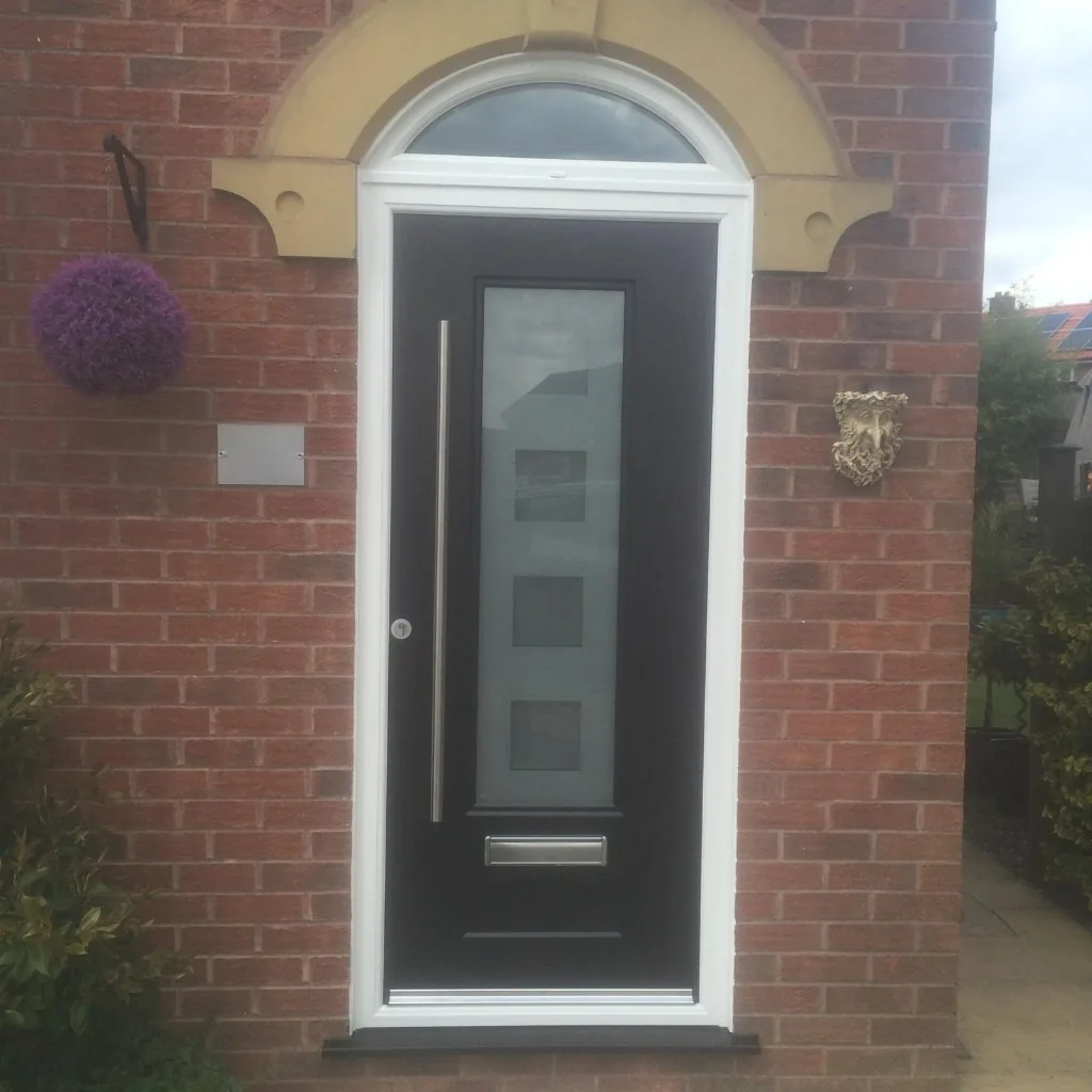 Black composite front door with arched top light