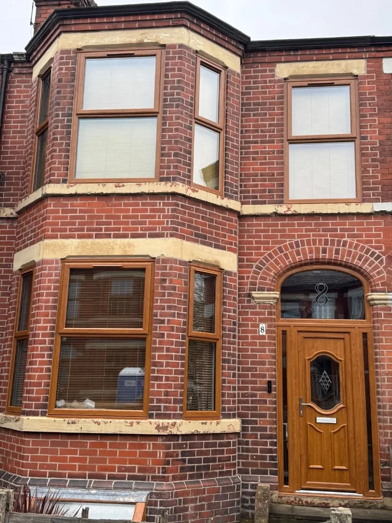 Golden oak uPVC bay windows and matching front door