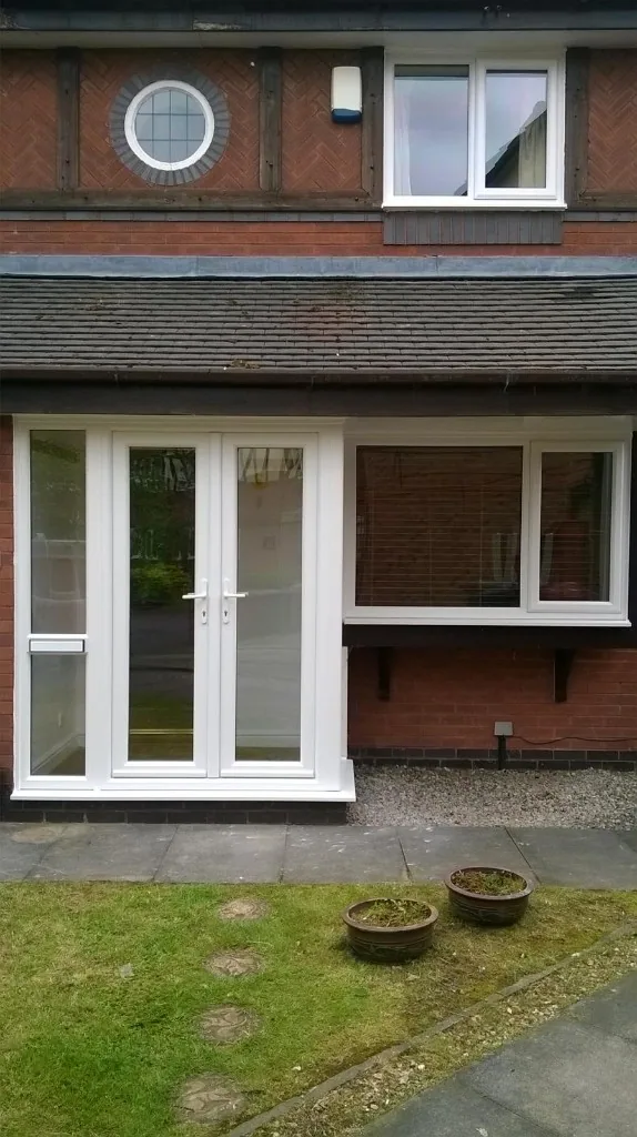 White uPVC French doors with side panel and windows