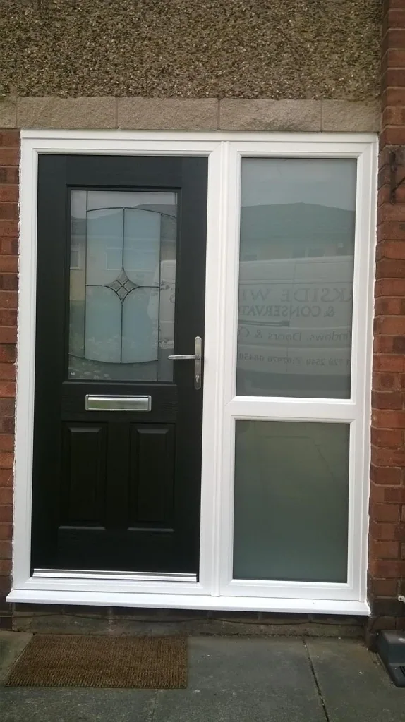 Black composite front door with frosted glass side panel