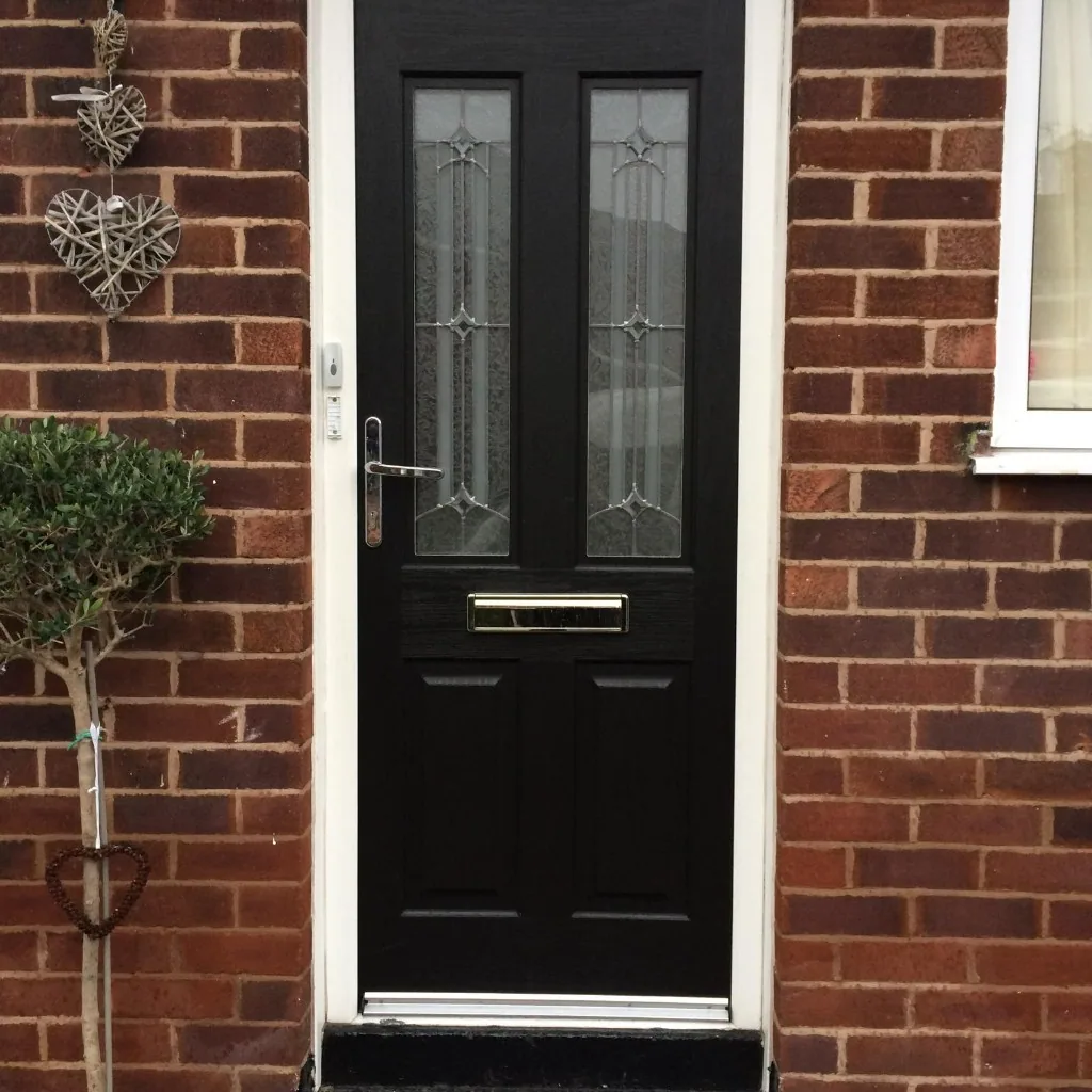 Black composite front door with decorative leaded glass