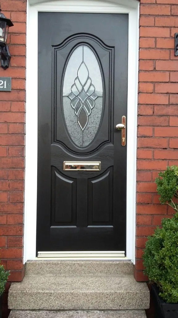 Black composite front door with decorative oval glass