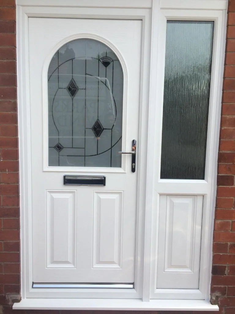 White composite front door with side panel and decorative glass