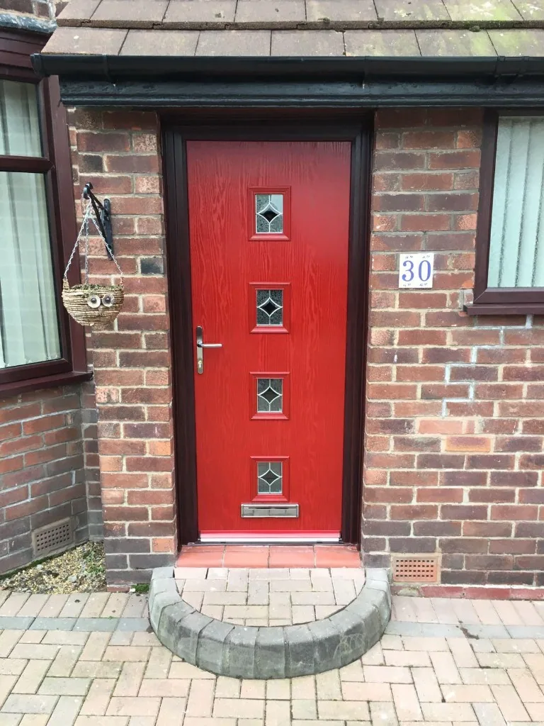 Red composite front door with four decorative windows