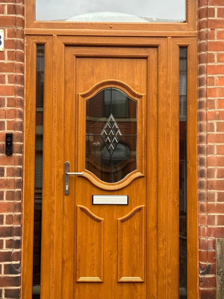 Golden oak front door with sidelights and top light