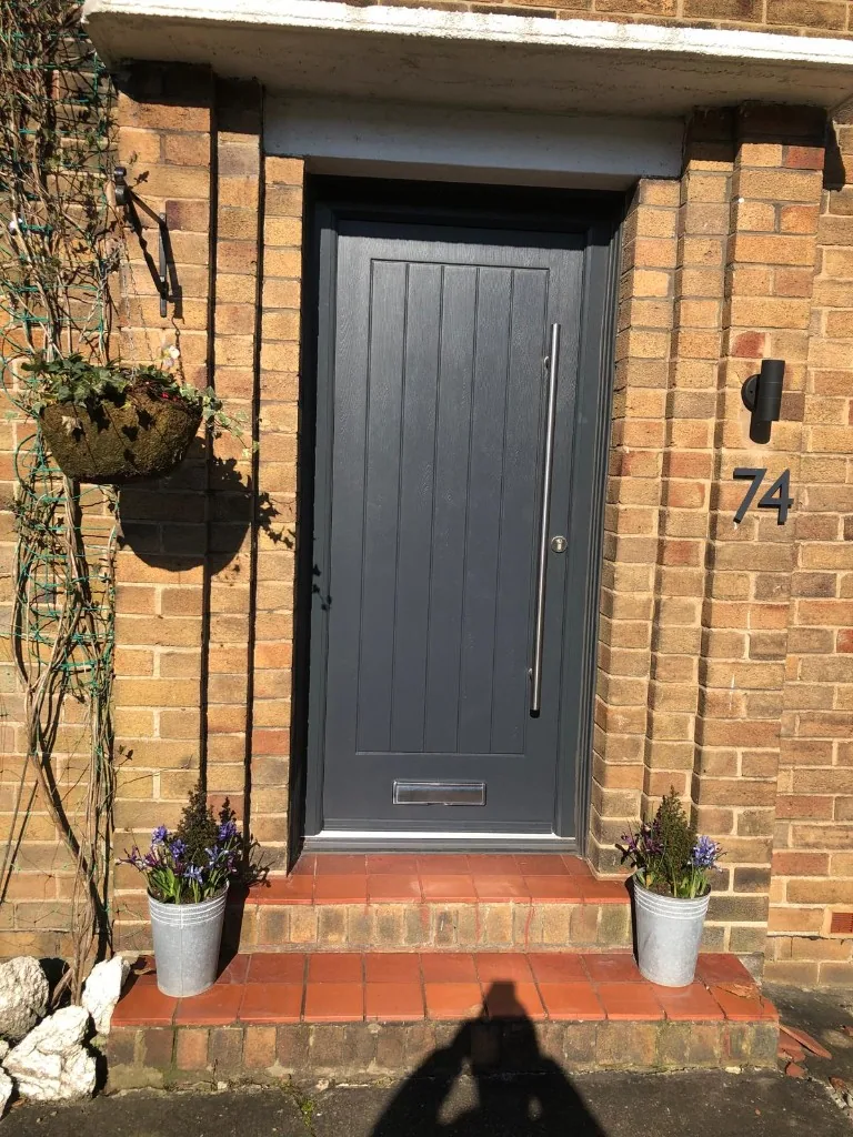 Anthracite grey composite front door with bar handle