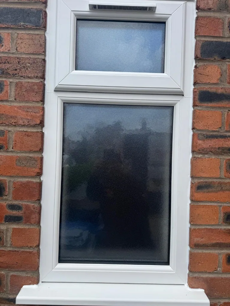 White uPVC window with obscure glass and trickle vent