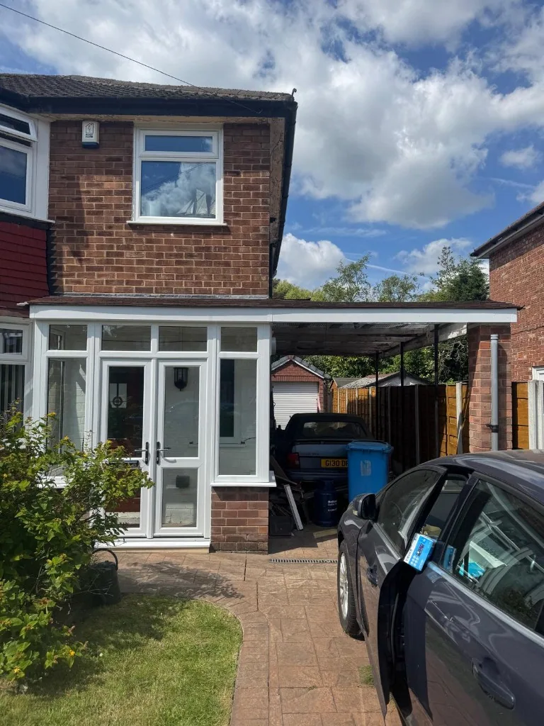 White uPVC porch with double doors and first floor window