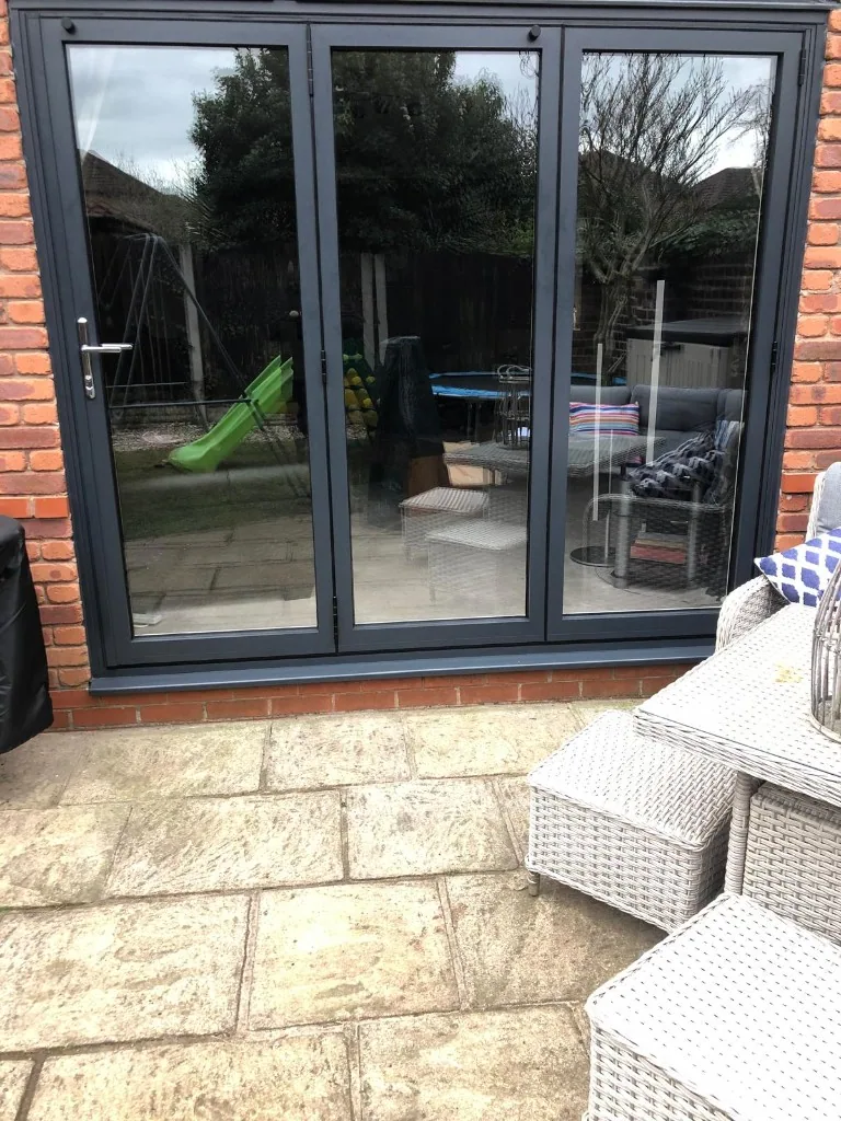 Anthracite grey three pane bi-fold doors
